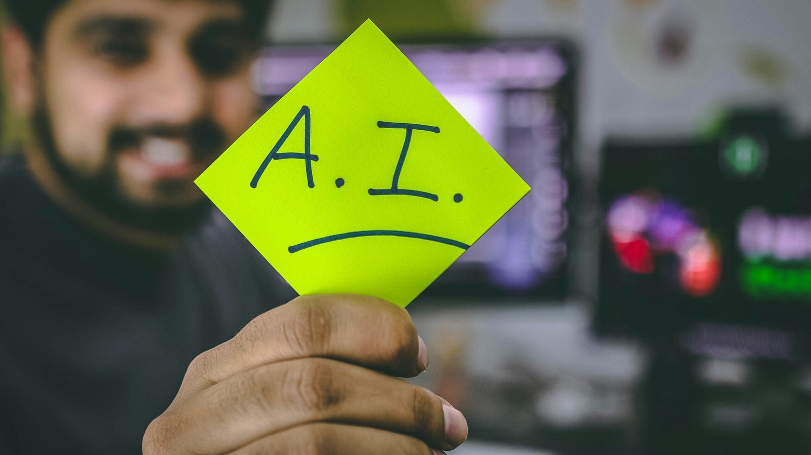 Entrepreneur holding a note with "A.I" representing AI tools for small business