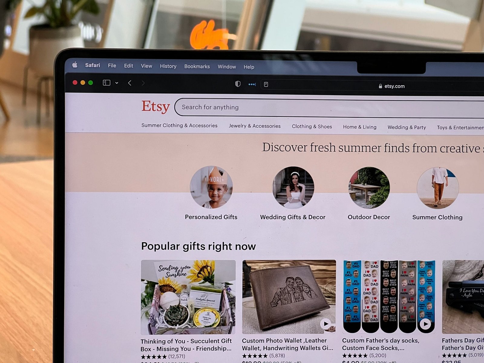 Laptop showing an Etsy storefront to represent how to sell on Etsy