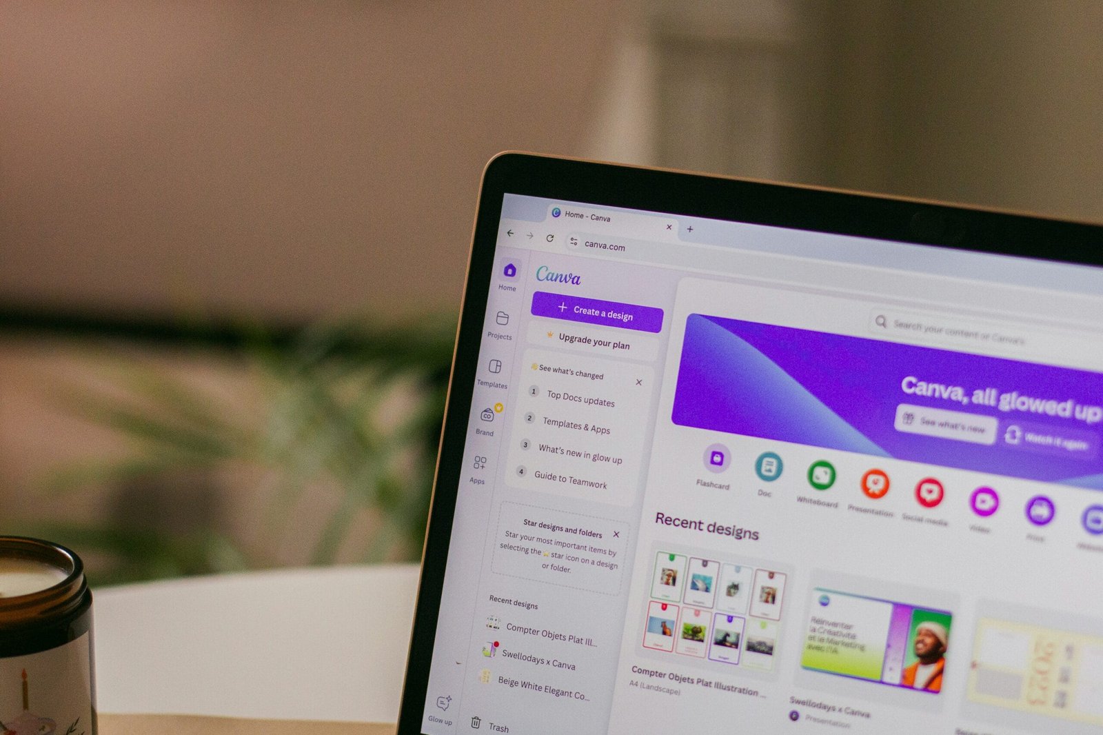 How to use Canva shown on a laptop screen with dashboard and templates visible